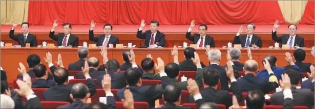  ?? PANG XINGLEI / XINHUA ?? Delegates to the Sixth Plenary Session of the 18th CPC Central Committee voted on Thursday in Beijing on two documents dealing with the discipline of the Party.