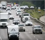  ?? DAVID ZALUBOWSKI — THE ASSOCIATED PRESS FILE ?? Motorists head west along Interstate 70to get an early start on the Fourth of July holiday weekend near Golden, Colo. Drivers are facing pricier fill-ups as more people hit the road for work, travel and other activities that the virus pandemic halted.