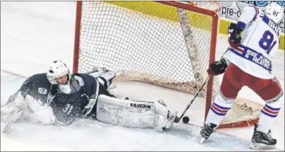  ?? JASON SIMMONDS/JOURNAL PIONEER ?? Summerside D. Alex MacDonald Ford Western Capitals forward TJ Shea caps a hat trick by beating St. Stephen Aces goaltender Zachary LeBlanc on a second-period breakaway. The Capitals defeated the Aces 7-0 in MHL (Maritime Junior Hockey League) play at...