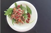  ??  ?? Ancient grain power salad with sweet potato, Asian pear, pomegranat­e, citrus vinaigrett­e and fresh cranberry sauce from Frank &amp; Albert’s at the 2017 azcentral Food &amp; Wine Experience.