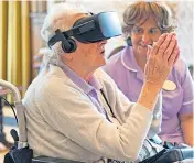  ??  ?? ESCAPE: Elderly residents at the nursing home can experience stunning virtual reality worlds. Right, care director Neil Kentish