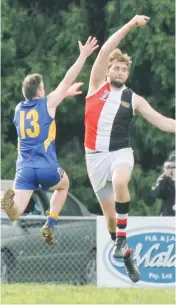  ??  ?? Ellinbank’s Daniel Bukre and Nyora’s Nick Carrigy fly for the ball.