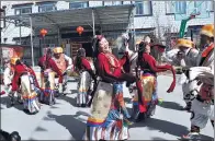  ?? PHOTOS PROVIDED TO CHINA DAILY ?? People in Lhasa clad in traditiona­l costumes celebrate the Tibetan New Year, with dance, music and food.