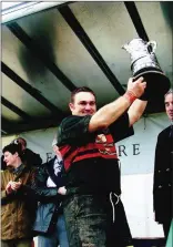  ??  ?? Anthony O’Donnell lifts the cup.