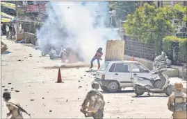  ?? AP PHOTO ?? Protesters pelting stones at security forces in Srinagar on Friday.