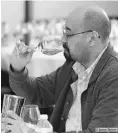  ?? SUPPLIED/ JASON DZIVER ?? Wine columnist Gurvinder Bhatia judging at the National Wine Awards of Canada