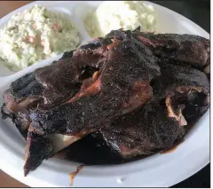  ?? Arkansas Democrat-Gazette/JENNIFER CHRISTMAN ?? A Rib Plate is plated with slaw and potato salad at Casey’s Bar-B-Q.