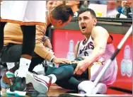  ?? GREGORY SHAMUS / GETTY IMAGES / AFP ?? Andrew Bogut
grimaces in pain after breaking his leg a minute into his Cleveland Cavaliers debut against the Miami Heat on Monday in Cleveland, Ohio.