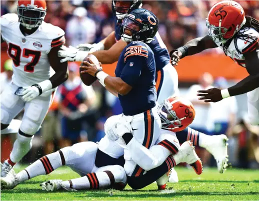  ?? EMILEE CHINN/GETTY IMAGES ?? The Browns sacked Justin Fields nine times and held him to a 41.2 passer rating in his first NFL start in 2021, a 26-6 Browns victory.