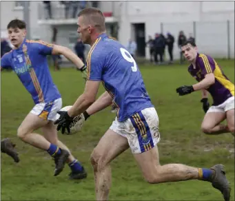  ??  ?? Wicklow’s Rory Finn drives forward against Wexford in Rathnew.