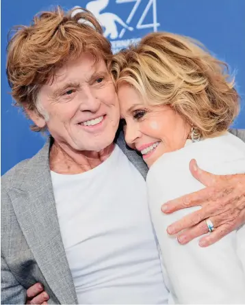  ??  ?? Close: Jane Fonda and Robert Redford in Barefoot In The Park, and embracing yesterday while promoting their latest film in Venice