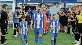  ?? ?? Guard of honour Maybole and the match official showed Renfrew the greatest respect before kick-off at New Western Park