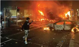  ?? Peter Murphy/AFP/Getty Images ?? A car and a bus on fire in central Dublin on Thursday after the stabbing attack. Photograph: