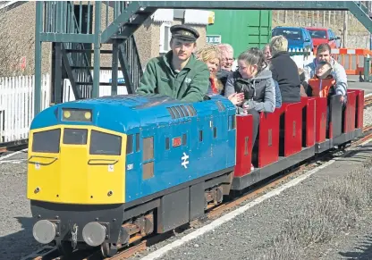  ??  ?? John Kerr at the controls at Arbroath seafront. He hopes to get the miniature railway up and running again as soon as pandemic guidelines allow it. Picture: Dougie Nicolson.