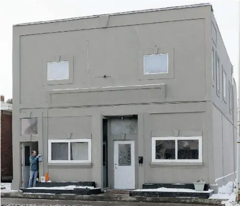  ??  ?? This apartment building located at 11242-86 Street in Edmonton is owned by Carmen Pervez. Most of his properties are identifiab­le by the grey stucco coating them, and a trapezoid over windows and doorways.