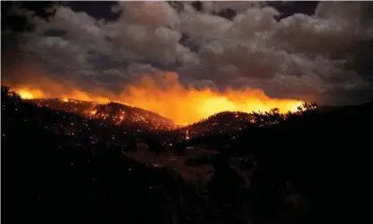  ?? ?? The McBride fire burns in the heart of the village in Ruidoso, New Mexico, on 12 April. Photograph: Ivan Pierre Aguirre/USA TODAY NETWORK/Reuters