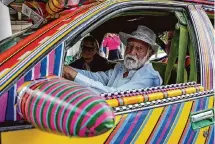  ?? ?? Best shows off his art car at the Art Car parade on April 13. He was one of three first-place winners.