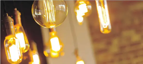  ?? GETTY IMAGES/ISTOCK PHOTO ?? With Edison bulbs, the light won't be harsh if the right wattage is used. Having switches with dimmers also helps, says interior designer Amy Zantzinger.