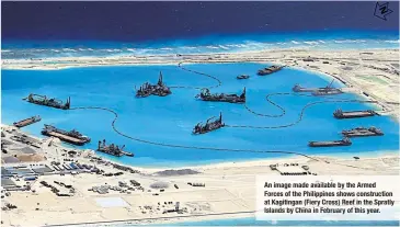  ??  ?? An image made available by the Armed Forces of the Philippine­s shows constructi­on at Kagitingan (Fiery Cross) Reef in the Spratly Islands by China in February of this year.