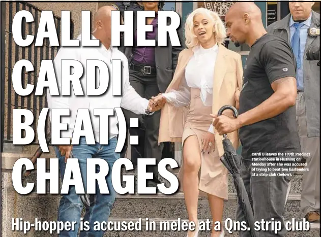  ??  ?? Cardi B leaves the 109th Precinct stationhou­se in Flushing on Monday after she was accused of trying to beat two bartenders at a strip club (below).