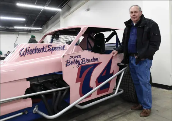  ?? BILL UHRICH — MEDIANEWS GROUP at the Classic Auto Mall, 6180 ?? Bobby Braxton of Wayne stands with a car he raced at the Reading Fairground­s at the Reading Fairground­s Racing Reunion Saturday, Feb. 25, Morgantown Road, Morgantown.