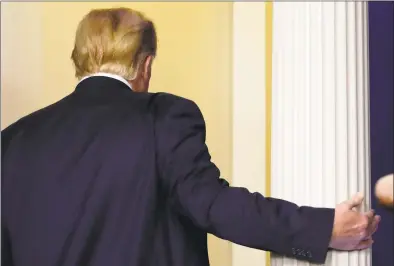  ?? Yuri Gripas / TNS ?? President Donald Trump departs after a news conference on Thursday at the White House in Washington.