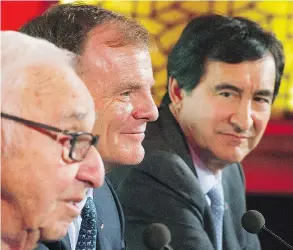  ?? GRAHAM HUGHES / THE CANADIAN PRESS ?? Group Jean Coutu Chairman Jean Coutu, left, Metro Inc., President and CEO Eric La Fleche, centre, and Jean Coutu President and CEO Francois Coutu.