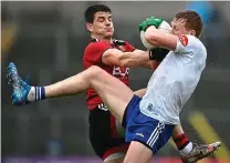  ?? ?? GRITTY: Micheál Bannigan of Monaghan (right) and Odhran Murdock