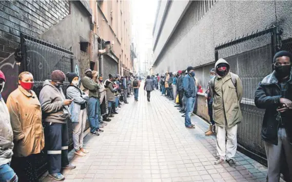  ?? Photo: Delwyn Verasamy ?? Desperate: People queue outside a labour department office to apply for Unemployme­nt Insurance Fund payouts during the Covid-19 outbreak. But unemployme­nt was a problem before the pandemic.