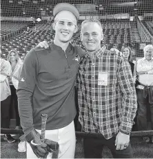  ?? Tom Szczerbows­ki / Getty Images ?? Cavan Biggio, left, finds time for a photo-op with his dad Craig before making his debut Friday in the majors with the Blue Jays.