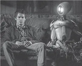  ?? PARAMOUNT ?? Joel ( Dylan O’Brien) shares a moment with a robot during his epic quest in “Love and Monsters.”