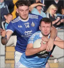  ?? Pic: Paul Connor ?? Naomh Mairtín’s Sam Mulroy takes down Ian Connor of Newtown Blues during Sunday’s Louth SFC final in Drogheda.
