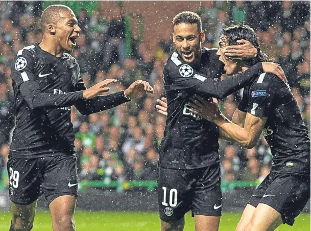  ??  ?? THREE OF THE BEST: Paris St Germain’s Kylian Mbappe, left, Neymar, centre, and Edison Cavani celebrate Neymar’s opening goal against Celtic