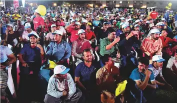  ?? Arshad Ali/Gulf News ?? Workers enjoy the 12th season of Camp Ka Champ organised at a workers accommodat­ion in Jebel Ali. Left: Suheb Abdul Razak (left) and Krishna Devkumar Bond, winners of the Antakshari (team category) contest.