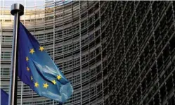  ??  ?? A European Union flag is seen outside the EU Commission headquarte­rs in Brussels, Belgium. — Reuters