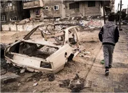  ??  ?? Training rides take Palestinia­n cyclists through the densely populated areas in GazaRemind­ers of the ongoing tension and violent con lict are all around in the Gaza Strip