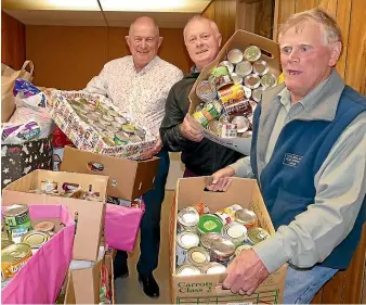  ??  ?? Harcourts Southland Food Bank Drive organisers Sean Bellew, left, and Wayne Ellis and food bank chairman Peter Swain sorting the many boxes and bags of non perishable food collected this week. JOHN HAWKINS/STUFF