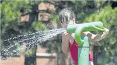  ?? JULIE JOCSAK/STANDARD FILE PHOTO ?? Leah Long cools down at the Catherine Street Park splash pad in this photo from July. A new splash pad is coming to Port Weller Community Centre.