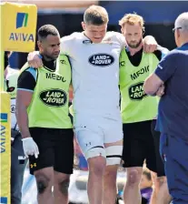  ??  ?? In pain: Wasps’ Jack Willis is helped off after rupturing knee ligaments at Allianz Park