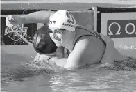  ?? AP Photo/Chris Carlson ?? ■ Katie Ledecky celebrates with Allison Schmitt after winning the women’s 200-meter freestyle Thursday at the U.S. national championsh­ips swimming meet in Irvine, Calif.