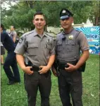  ?? PEG DEGRASSA MEDIA NEWS GROUP PEG DEGRASSA MEDIA NEWS GROUP ?? Prospect Park police officers Eric Hollenbach, left, only sworn onto the force three weeks ago, and Chris Bassoline, a 12-year veteran of the department, were among the law enforcers present at the National Night Out Tuesday in Park Square.
Boothwyn residents, left to right, Mia Mayne, 8, Bill Reese, Gabby Reese, 8, and Diane Lepard, enjoyed a slice of Italiana’s pizza on the back of a Prospect Park fire truck during Tuesday night’s National Night Out in Park Square.