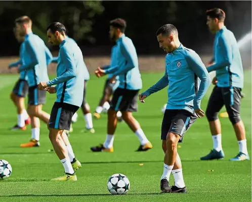  ??  ?? Should be a cinch: Eden Hazard (second from right) joining the other Chelsea players in training for today’s Champions League Group C clash against Azerbaijan minnows Qarabag.