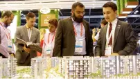  ?? — Photos by Juidin Bernarrd ?? Visitors check out scale models of projects at the pavilions of MAG Lifestyle Developmen­t, Sobha Realty and The Heart of Europe at Cityscape Global in Dubai on Wednesday.