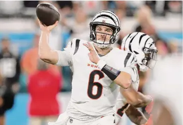  ?? Courtney Culbreath/Getty Images ?? Jake Browning and the Cincinnati Bengals have won three straight games, vaulting into the AFC playoff race even after losing Pro Bowl quarterbac­k Joe Burrow for the season to a torn ligament in his wrist.