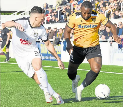  ?? FM19702552 ?? Maidstone’s Ibby Akanbi takes on Kyle Connolly