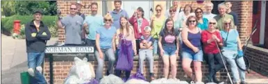  ??  ?? Volunteers who helped to clear Norman Road of litter