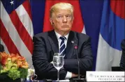  ?? AP ?? President Donald Trump listens during a New York luncheon with South Korean President Moon Jae-in and Japanese Prime Minister Shinzo Abe on Thursday.