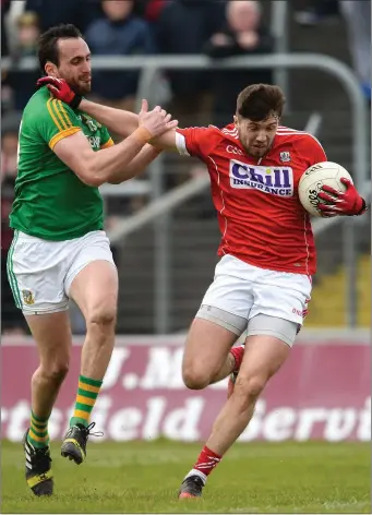  ??  ?? Graham Reilly tussles with Cork’s Tomas Clancy.