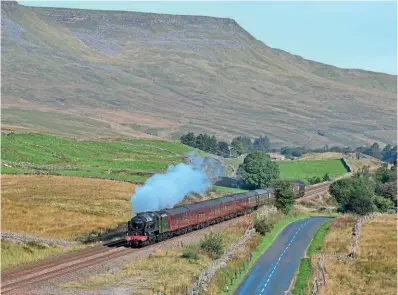  ?? ?? LMS 4-6-0 No. 46115 Scots Guardsman heads the Settle & Carlisle Railway Developmen­t Company’s 1Z70 30th anniversar­y steam special from Carlisle to York on September 17 through Shotlock, with Wild Boar Fell in the background. An early morning southbound steam excursion over the route has been a great rarity in the heritage era. DAVE WILSON