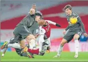  ?? REUTERS ?? Arsenal's Alexandre Lacazette is tackled by Man United’s Harry Maguire during their Premier League match.